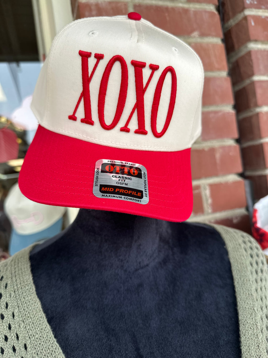 Red and white cap with 'XOXO' text 