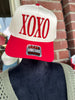 Red and white cap with 'XOXO' text 